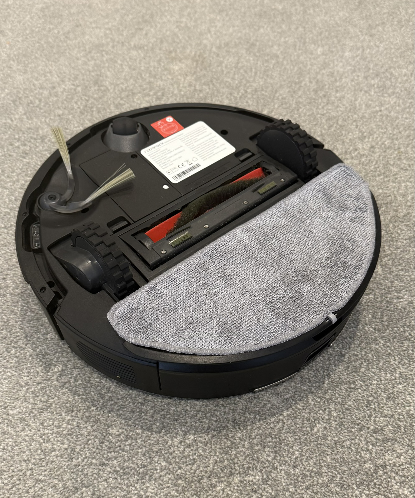 Roborock Q7 M5 underside revealing roller, brushes and semi-circle mop pad in Victoria Woollaston&#039;s home
