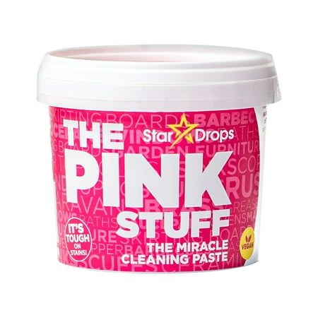 A pink plastic container with 'The Pink Stuff' branding across the front.