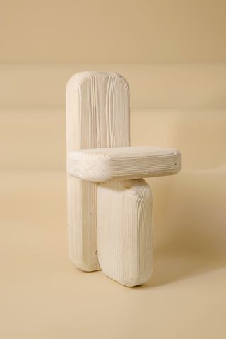 A chair made of three chunky wooden elements by Lisa Ertel