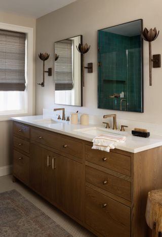 Beige bathroom with copper sconces