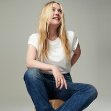 Split image of Dakota fanning for madewell campaign wearing white t-shirt and jeans on grey background 