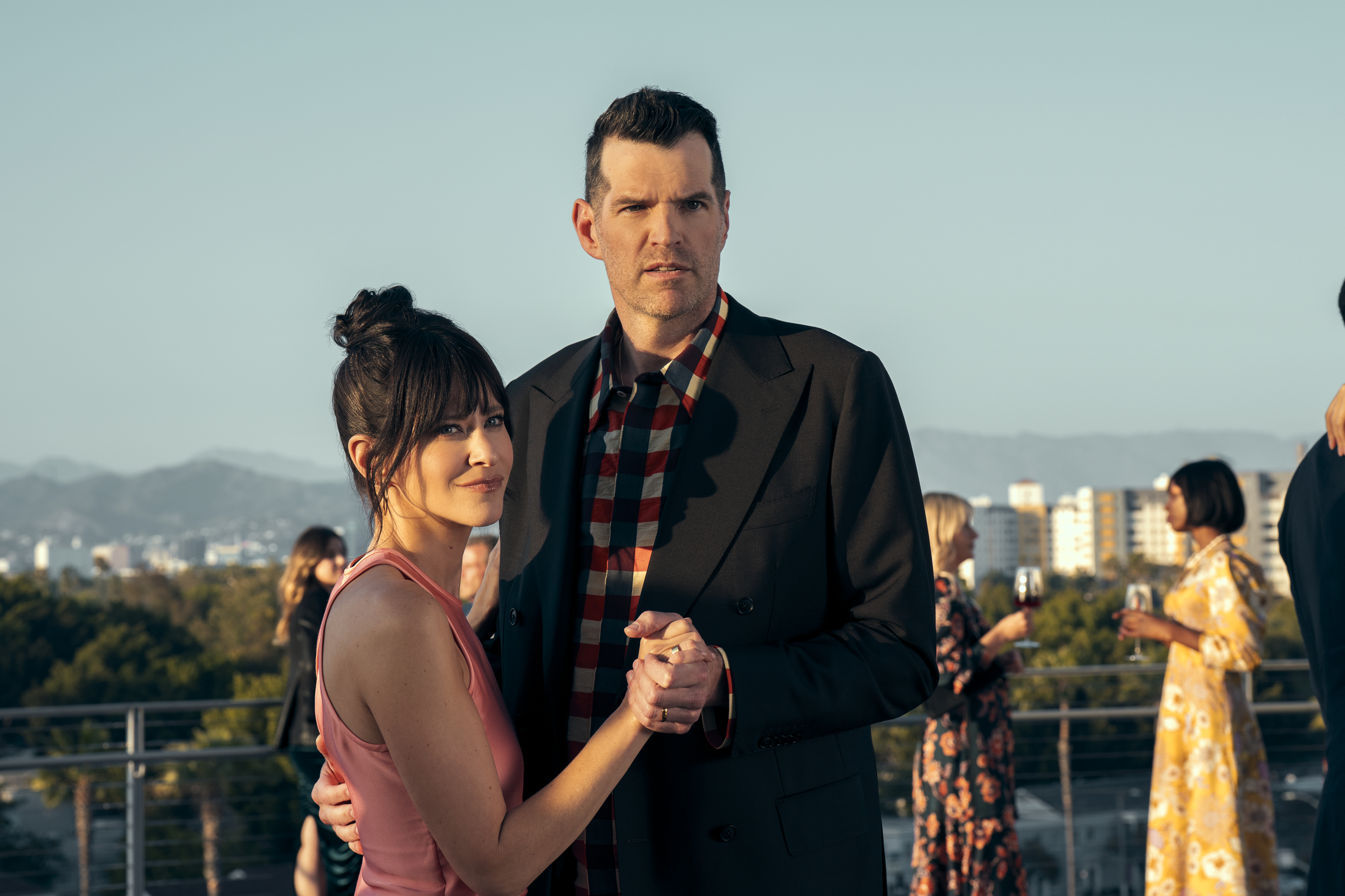jackie tohn as esther and timothy simons as sasha embracing on a rooftop in nobody wants this season 2 finale