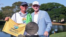 Brandt Snedeker poses with his caddie and the trophy after he won the 2026 Myrtle Beach Classic
