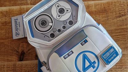 A HERBIE Fantastic Four Loungefly bag on a wooden table