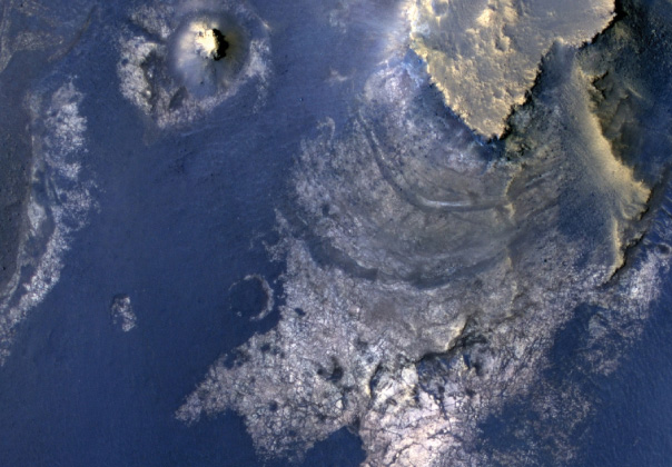 View of layered rocks on the floor of McLaughlin Crater on Mars by the MRO spacecraft.