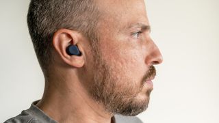 Wearing the Jabra Elite 8 Active earbuds side view.
