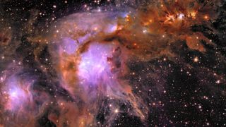A stunning, billowing cloud of purple and orange gas in space