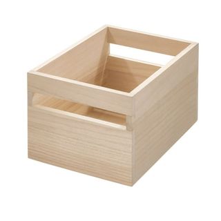 A light wooden storage bin with cutout handles 