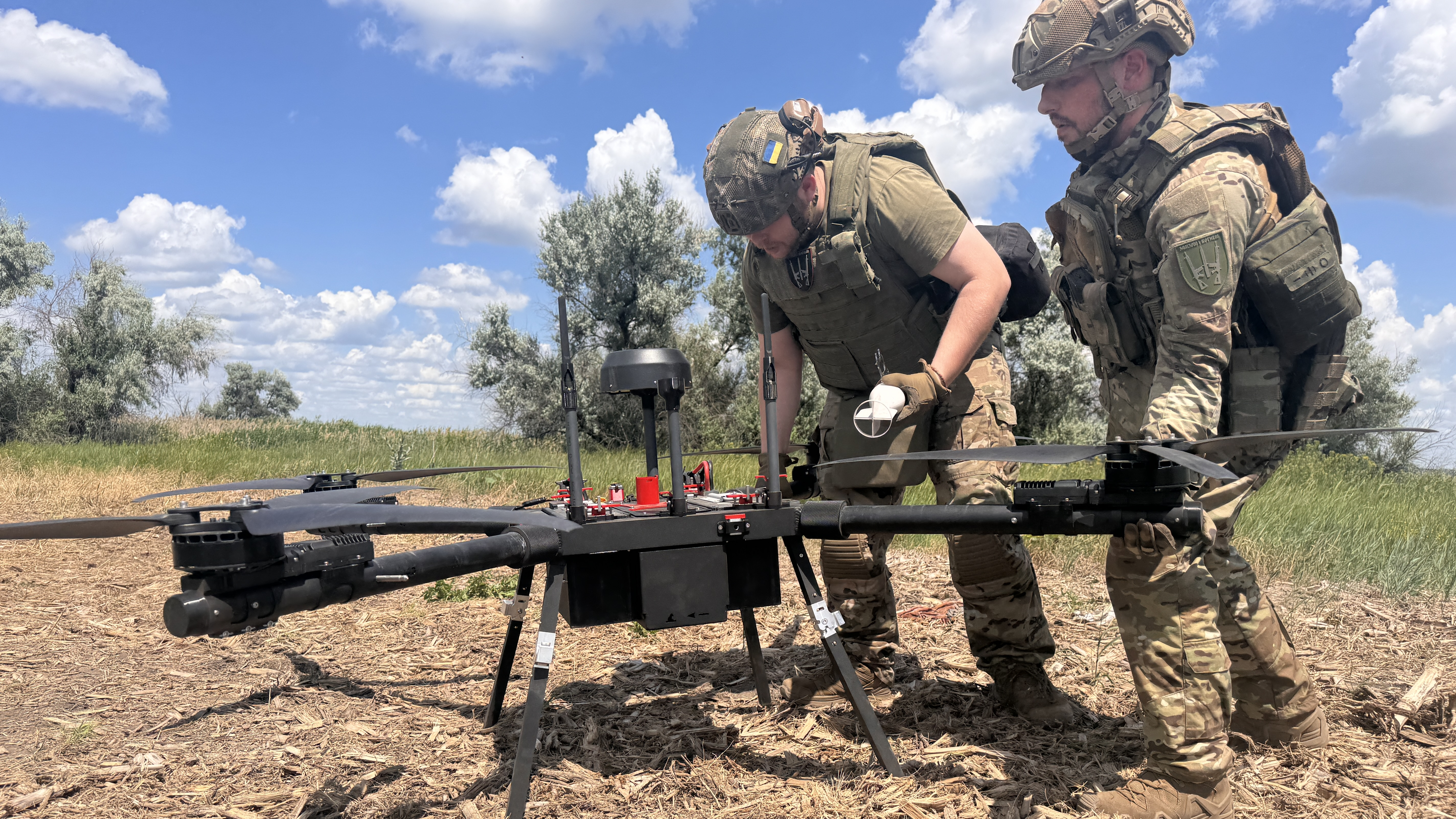 Ukranian soldiers repair a drone during the war against Russia
