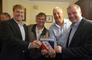 The Explorers Club president Richard Wiese (at left) accepts the donation of an Explorers Club flag from Mark Armstrong (second from left), with astronaut Mike Massimino and explorer David Concannon at The Explorers Club headquarters in New York City on May 22, 2019. The flag was carried by Mark's father, Neil Armstrong, to the surface of the moon on Apollo 11, the first moon landing mission, in July 1969.