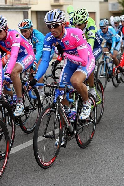 Daniele Bennati of Team Lampre uses the radio to call back to the team car