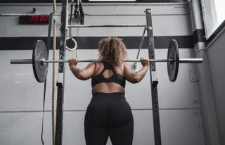 Weight lifting for back pain: Woman lifting weights