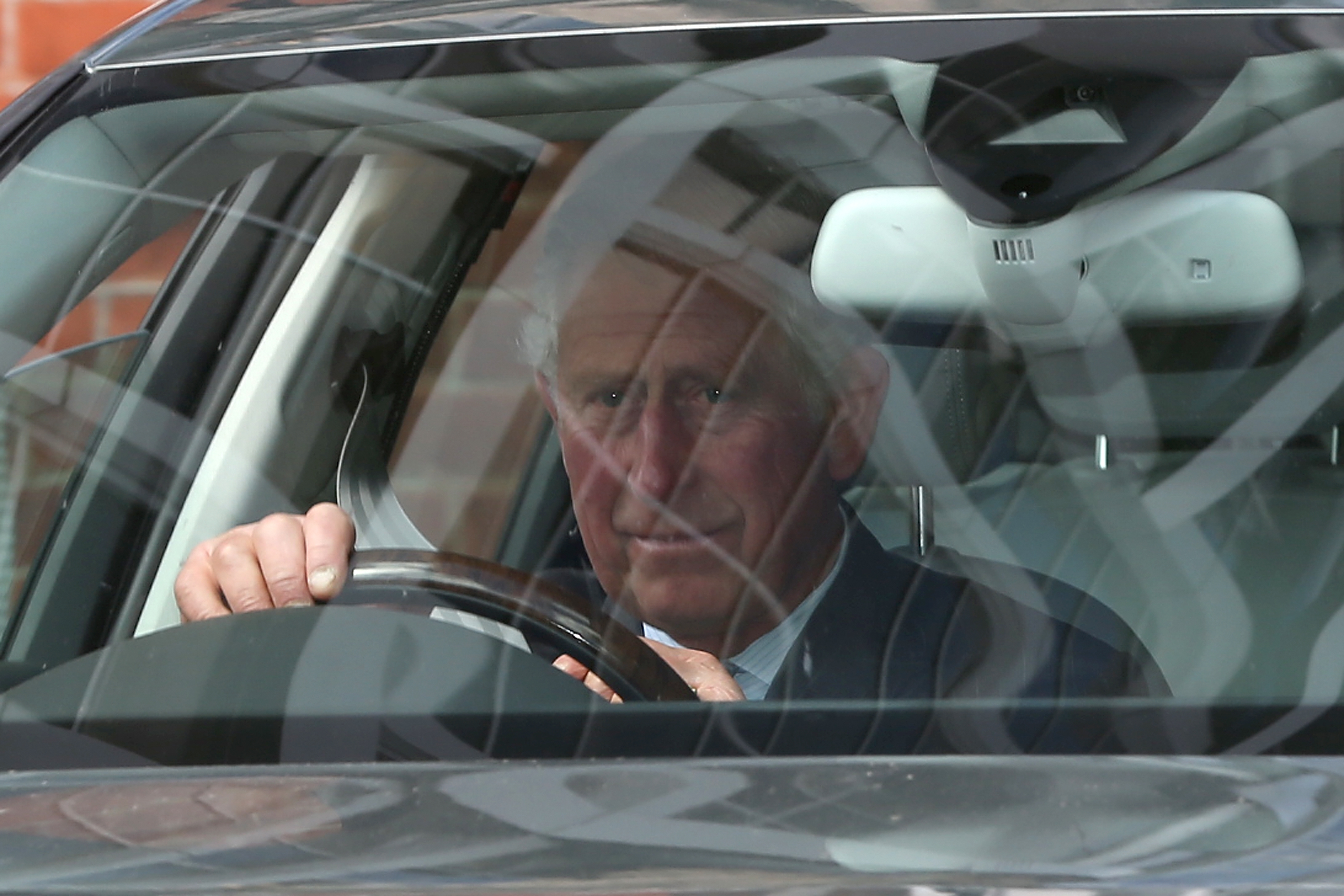 King Charles driving a car in 2015