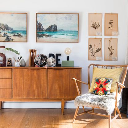 living room with white wall and wooden chair on wooden floor