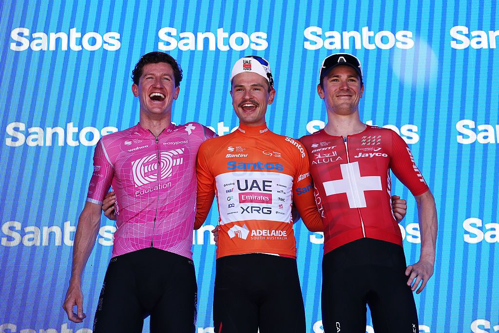 STIRLING, AUSTRALIA - JANUARY 25: (L-R) Harry Sweeny of Australia and Team EF Education - EasyPost on third place, race winner Jay Vine of Australia and UAE Team Emirates - Orange Santos Leader&amp;amp;apos;s Jersey and Mauro Schmid of Switzerland and Team Jayco AlUla on second place pose on the podium ceremony after the 26th Santos Tour Down Under 2026, Stage 5 a 169.8km stage from Stirling to Stirling / #UCIWT / on January 25, 2026 in Stirling, Australia. (Photo by Con Chronis/Getty Images)