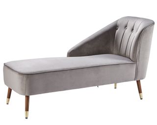 grey chaise longue with dark wooden legs and gold ascents at base