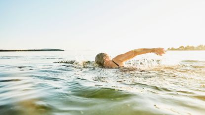 Person swimming in open water
