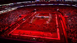 Super Bowl 2024 half-time show wide shot, red lighting