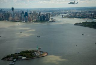 Enterprise Flies over the Statue of Liberty in New York Harbor