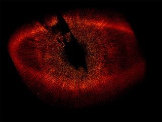This Hubble Space Telescope image shows a protoplanetary disk of dust around the nearby star Fomalhaut (HD 216956).