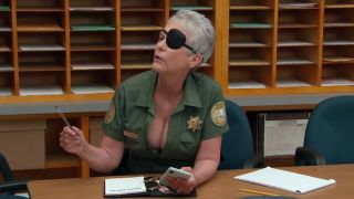 Lt. Donna Fitzgibbons in eyepatch and showing cleavage on Reno 911: Defunded