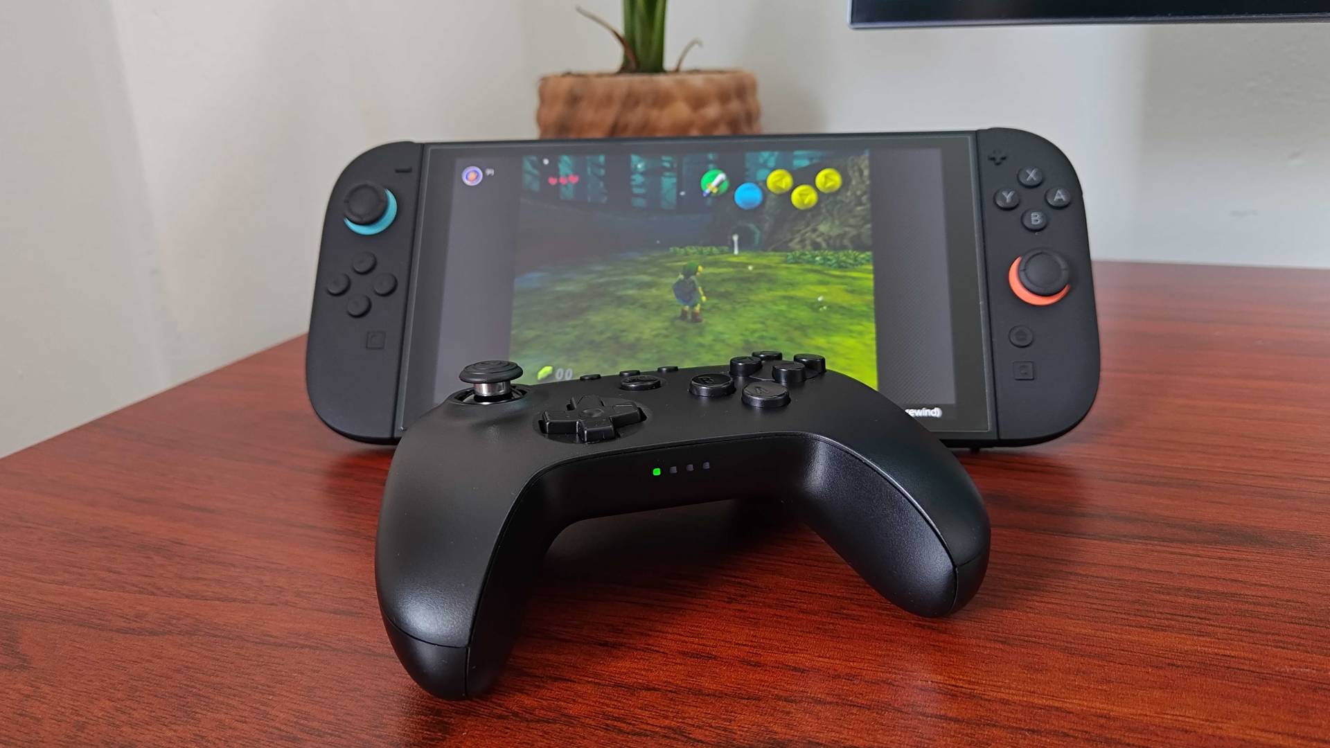 8Bitdo N64 Bluetooth controller next to Switch 2 running Zelda: Majora&#039;s Mask.