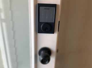 Schlage Sense Smart Deadbolt in Matte Black installed on a door