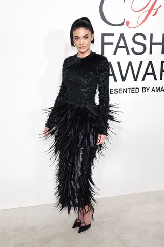 Kylie Jenner wears a feathered dress to the 2024 CFDA awards