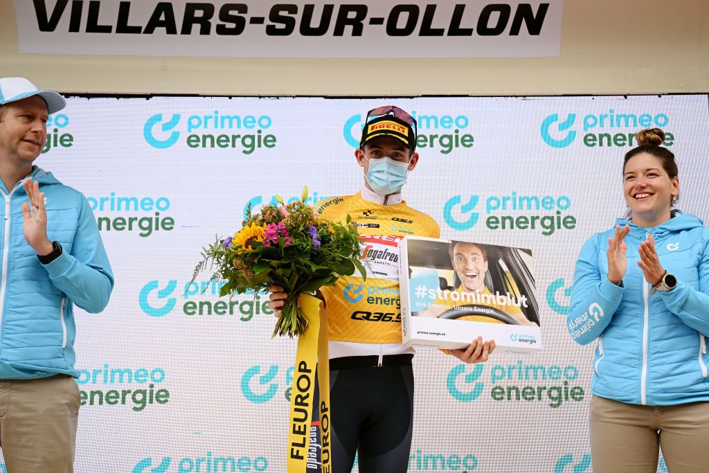 VILLARSSUROLLON SWITZERLAND JUNE 13 Mattias Skjelmose Jensen of Denmark and Team TrekSegafredo celebrates at podium as Yellow leader jersey during the 86th Tour de Suisse 2023 Stage 3 a 1438km stage from Tafers to VillarssurOllon 1256m UCIWT on June 13 2023 in VillarssurOllon Switzerland Photo by Dario BelingheriGetty Images