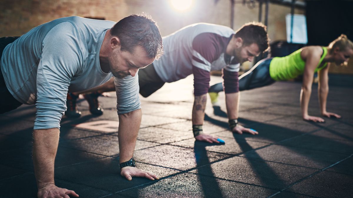 An exercise class performing push-ups