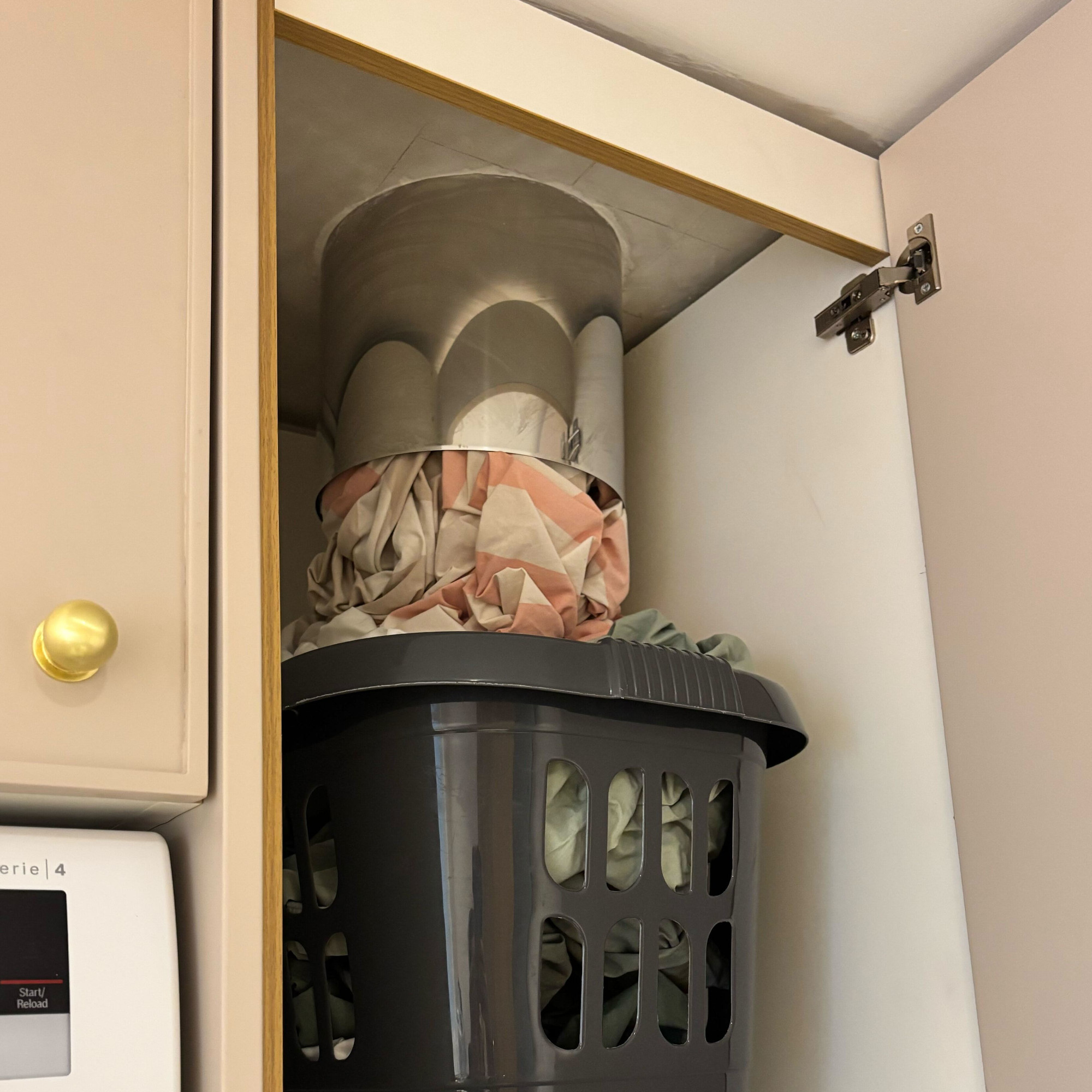 laundry chute in a cupboard