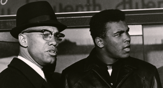 Malcolm X and Muhammad Ali standing side by side