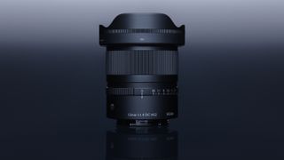 Sigma 12mm F1.4 DC Contemporary lens on a dark gradient background