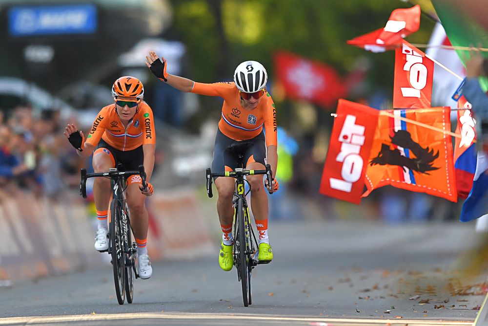 Amy Pieters and Annemiek van Vleuten celebrate their countrywoman Anna van der Breggen's win at the 2018 world championships