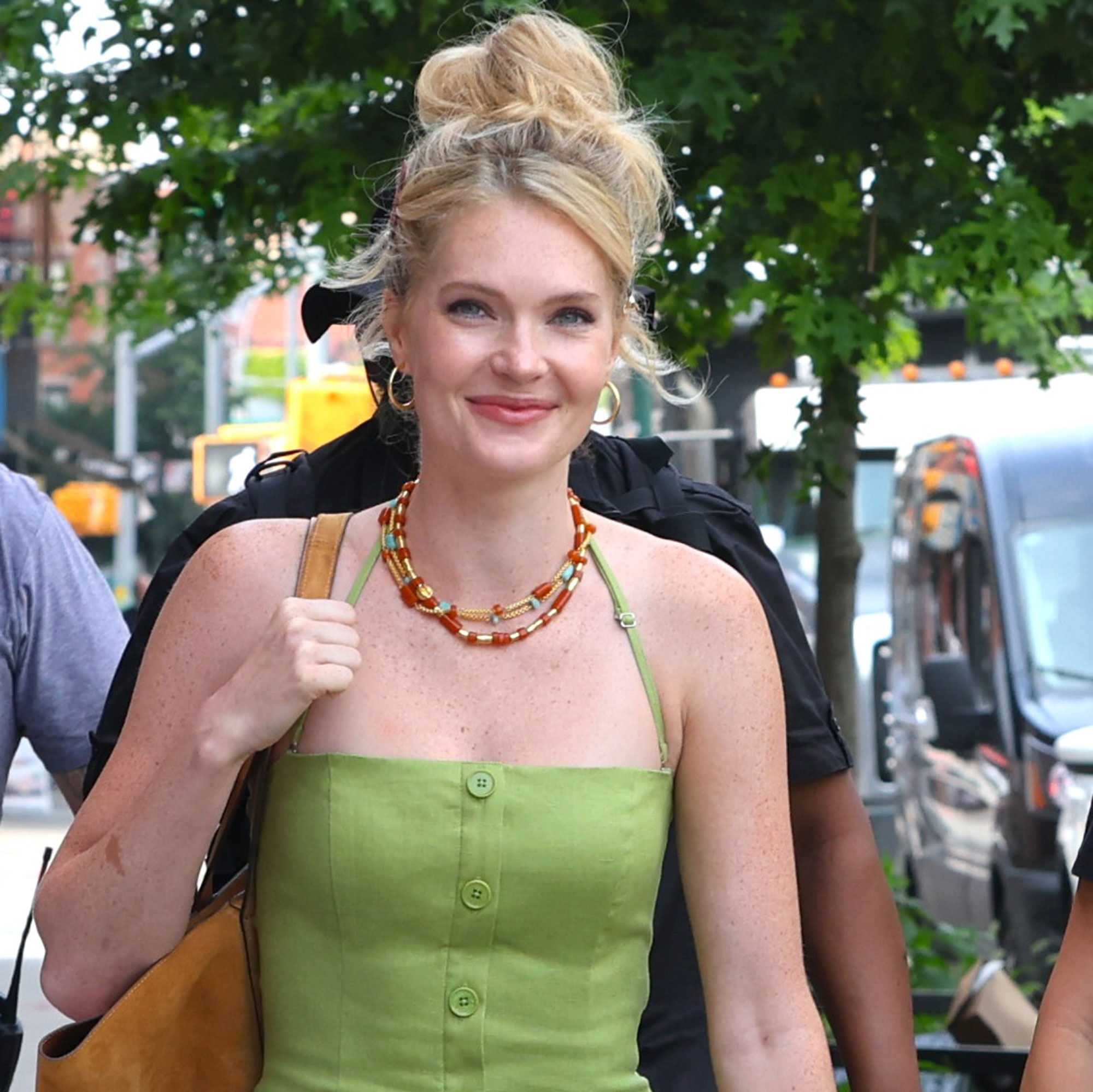 Meghann Fahy wears a green dress by Reformation