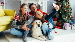 Labrador with family and girl taking selfie