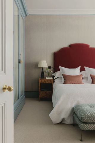 bedroom with red headboard