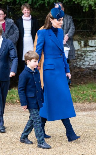 Kate Middleton in an all-blue outfit, walking with Prince Louis at Sandringham, Christmas 2023