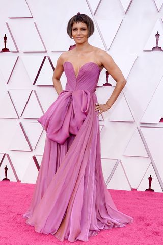 Halle Berry wears a pink/purple tulle dress as she attends the 93rd Annual Academy Awards at Union Station on April 25, 2021 in Los Angeles, California.