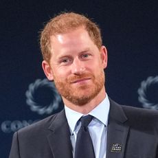 Prince Harry smiles while wearing a suit and tie onstage during an appearance at the Concordia Summit in New York on Monday, September 23, 2024