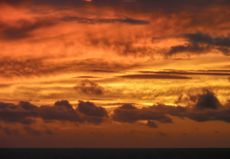 A golden sun sets over the East China Sea, near Okinawa, Japan.