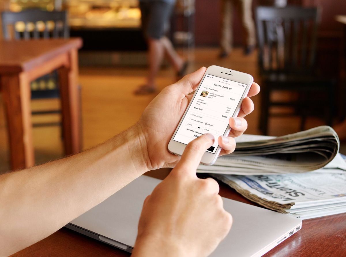 A user navigating to the Square app&amp;#039;s checkout page on their mobile phone