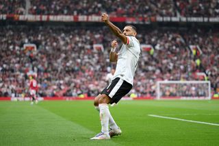 MANCHESTER, ENGLAND - SEPTEMBER 01: Mohamed Salah of Liverpool celebrates scoring his team's third goal during the Premier League match between Manchester United FC and Liverpool FC at Old Trafford on September 01, 2024 in Manchester, England. (Photo by Michael Regan/Getty Images)