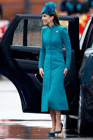 Catherine, Princess of Wales (in her role as Colonel of the Irish Guards) wears a teal blue co-ord and heels arrives in her Range Rover car to attend the 2023 St. Patrick's Day Parade at Mons Barracks on March 17, 2023 in Aldershot, England. This years' parade is the first The Princess of Wales is attending as Colonel of the Regiment after succeeding her husband, Prince William, Prince of Wales, in December 2022