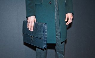Gieves & Hawkes A/W 2014 - man's hand holding a clutch bag