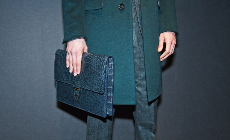Gieves & Hawkes A/W 2014 - man's hand holding a clutch bag