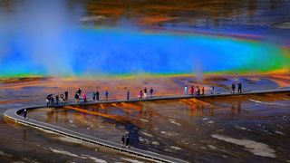 Hikers on boardwalk at Grand Prismatic, Yellowstone National Park, USA