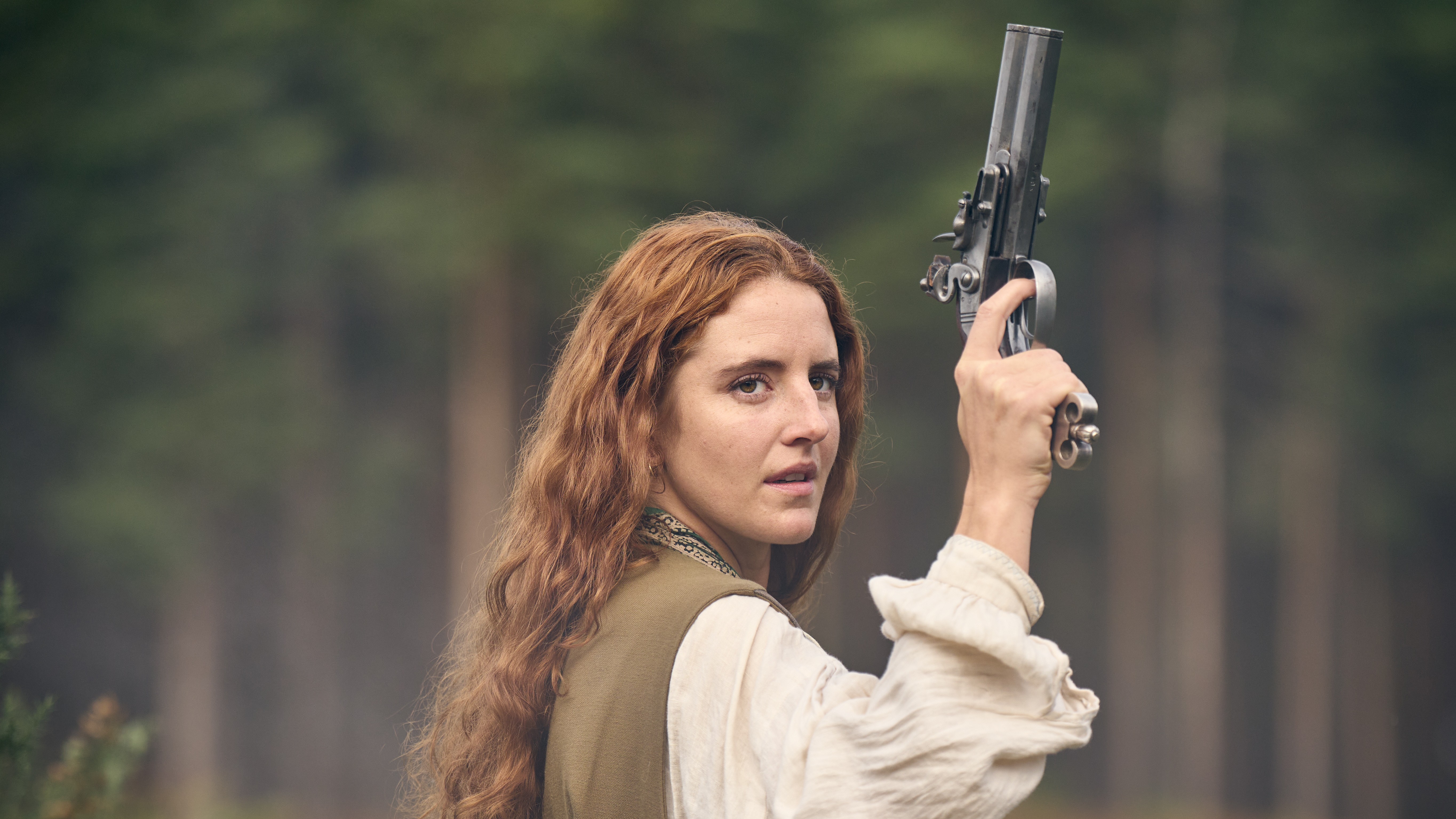 Nell (Louisa Harland) poses with a gun in Renegade Nell