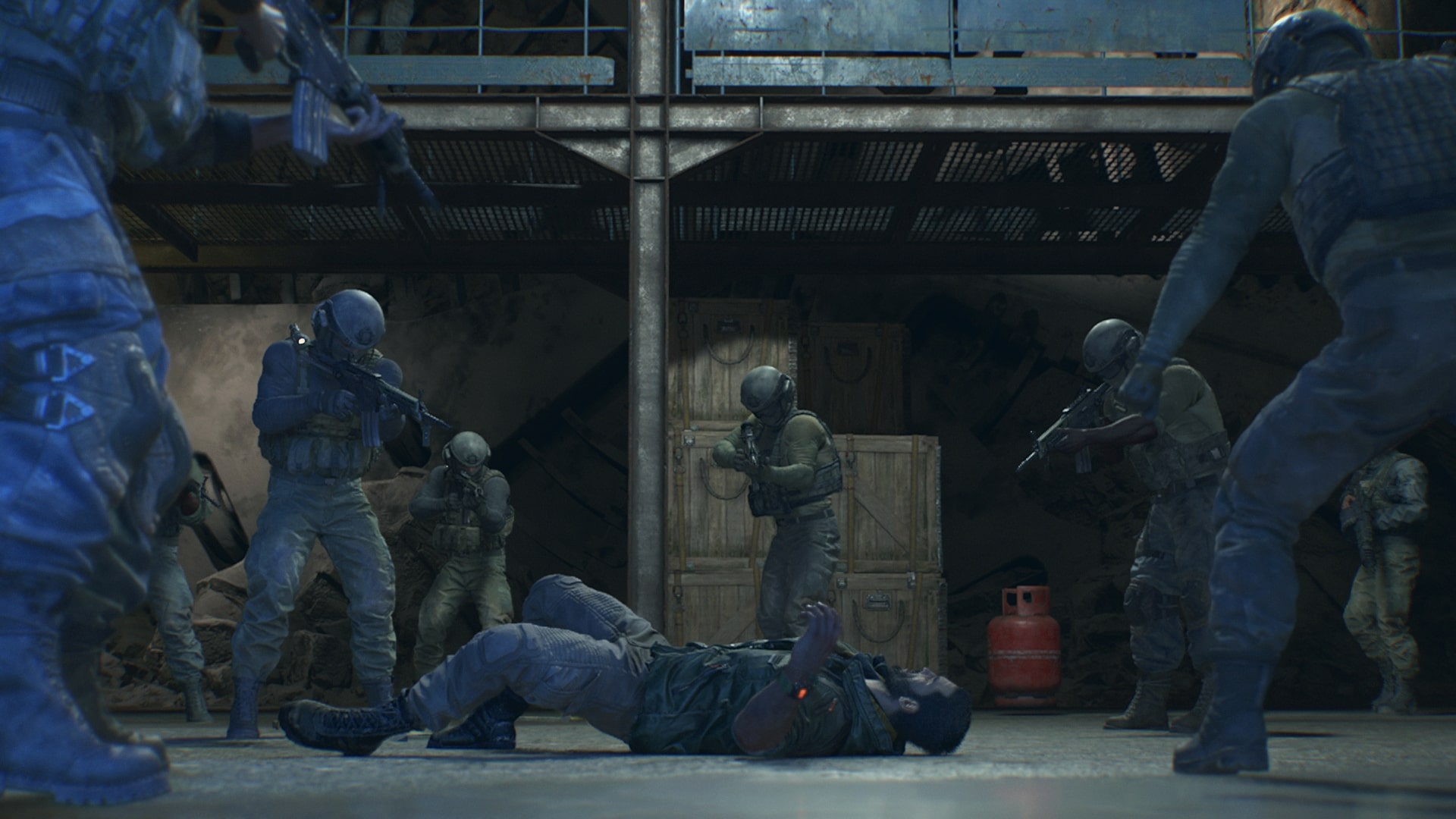 Dying Light: The Beast screenshot of Kyle Crane prone on the ground in an underground bunker, surrounded by soldiers carrying rifles