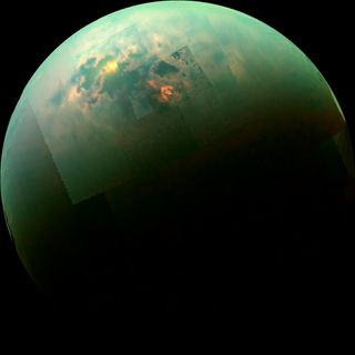Today, Saturn's moon Titan has polar seas (shown here with the sun glinting off), but in the past, it may have been a giant snowball with a strong resemblance to Pluto.